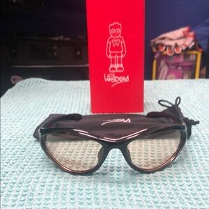 Wisdom Black Sporty Wraparound Sunglasses with light amber lenses.